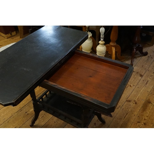 472 - An Aesthetic design Ebonised Fold-Over Top Card Table with under tier. Measuring: 88cms across x 43c... 