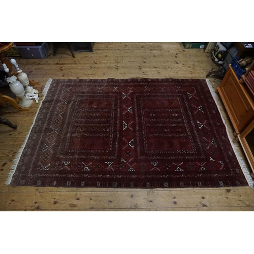 546 - A Red Ground Triple Diagonal Bordered Afghan Rug with a Gold pattern. Measuring: 2.45m x 1.70m.