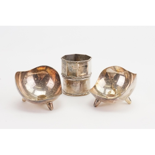 69 - A Pair of Silver Plated Danish Candlestick Holders along with Napkin Rings. (One Silver).