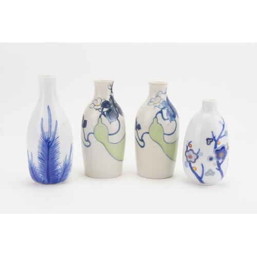 681 - Three Japanese Blue & White Floral decorated Sake Bottles.