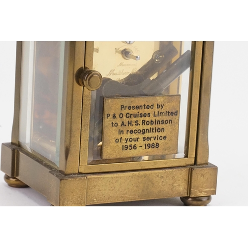 228 - A Mathew Norman of London brass four plate carriage clock, with visible escapement and carrying hand... 