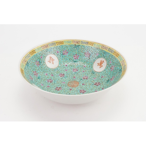 650 - A Cantonese enamelled Turquoise Ground Bowl decorated with Characters & Flowers with a Yellow Border... 