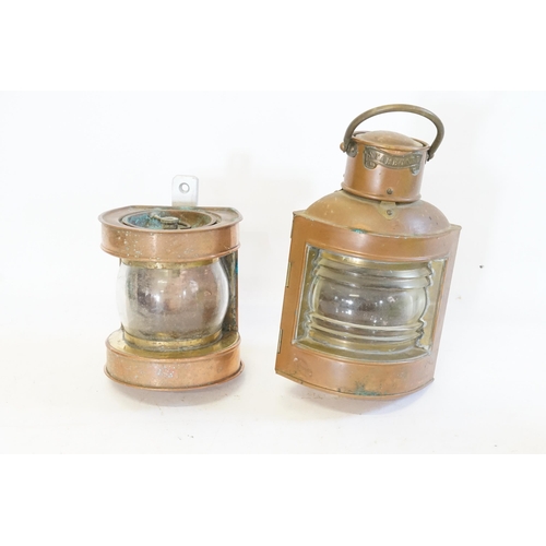 631 - Two Ship's Storm Lights in Copper Cases. Measuring: 23cms & 24cms.