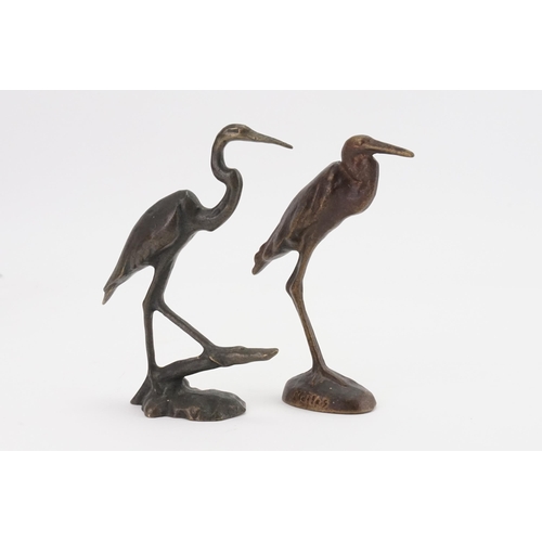 571 - A Pair of Bronzed Crane Ornaments by Noilss. Standing: 14cms High.