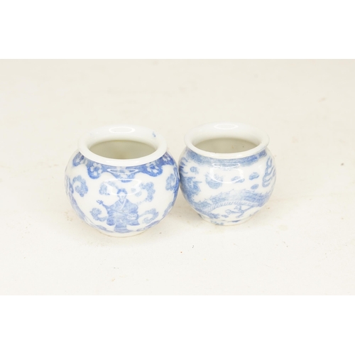 652 - Two Chinese Blue & White Paste Pots decorated with a dragon & procession.