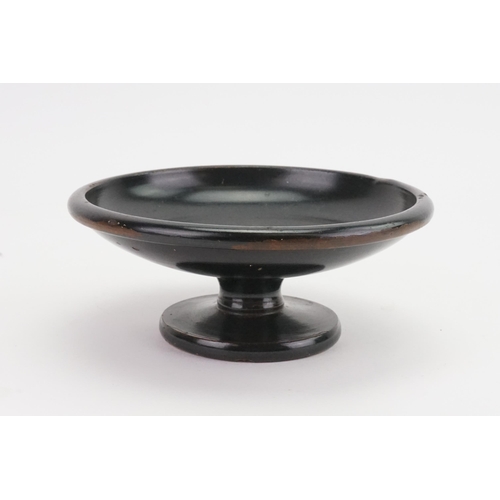 690 - A Black Glazed Terracotta Bodied Shallow Bowl on pedestal base. Ref Number: A2584. Southern Italy, L... 