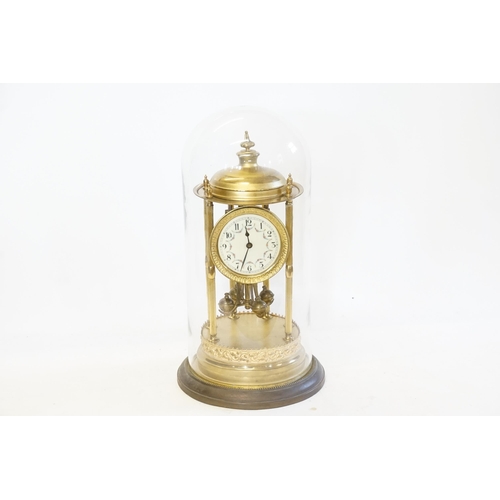 232 - A French Brass Cased Anniversary Clock resting on Six Columns, Osalating Four Ball Pendulum, enamell... 