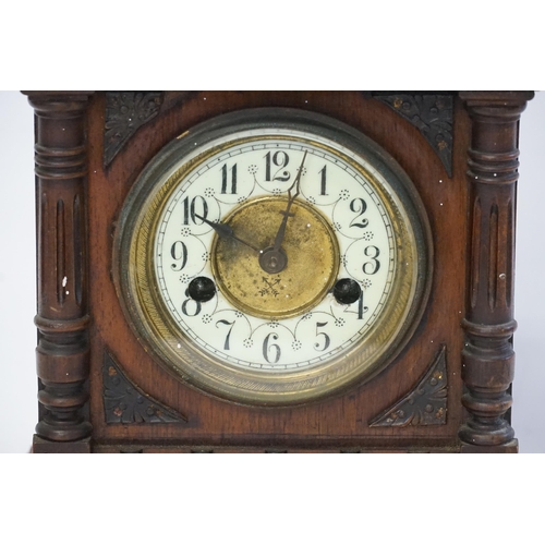 235 - A Victorian stained mahogany bracket clock, with white face.