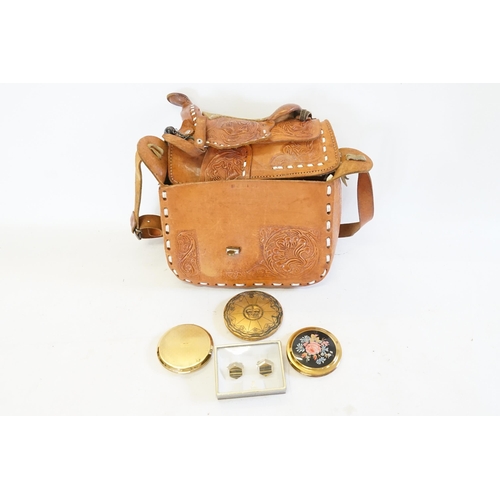 615 - A Mexican Leather Handbag designed as a saddle, Powder Compacts, etc.