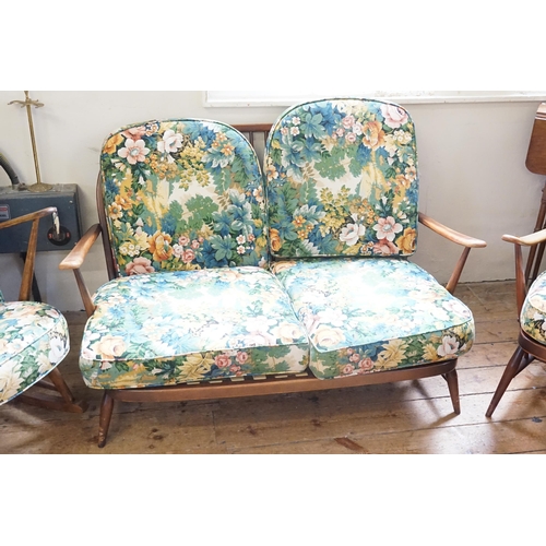 492 - An Ercol Stained as Oak Three Piece Lounge Suite with turned stick back & Crinoline Cross Stretchers... 