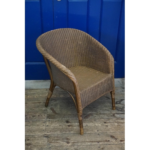 487 - A Lloyd Loom Chair in Gold.