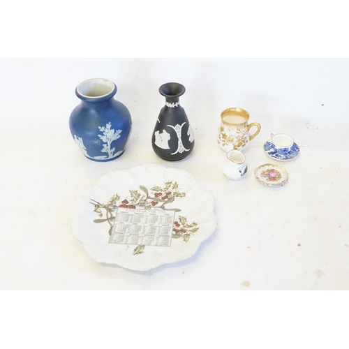 752 - A Wedgwood Blue Slip Ware Vase, a Basalt Vase, Royal Doulton Burslem Chocolate Cup, etc.