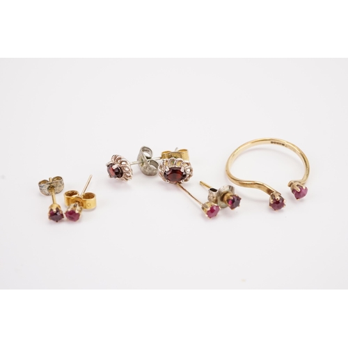 144 - A 9ct gold ruby set ring, along with the matching earrings, and two other pairs.