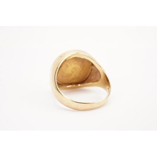 147 - A 1914 half sovereign mounted in 9ct gold ring. Weight 12.8g. Size Z+1.