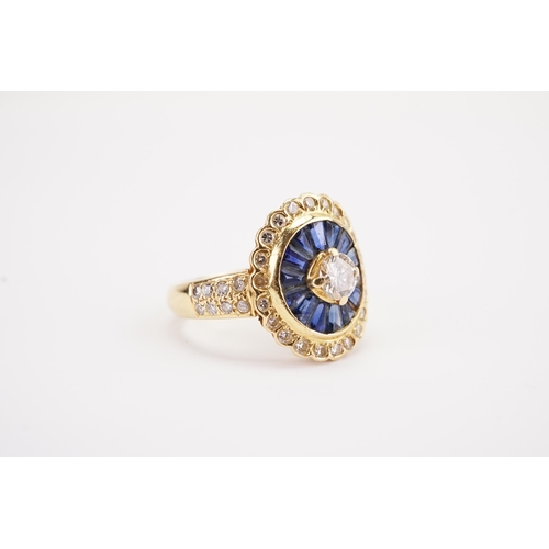 141 - A Art Deco 18ct gold diamond and sapphire set ring, set with sapphire baguettes and brilliant cut di... 