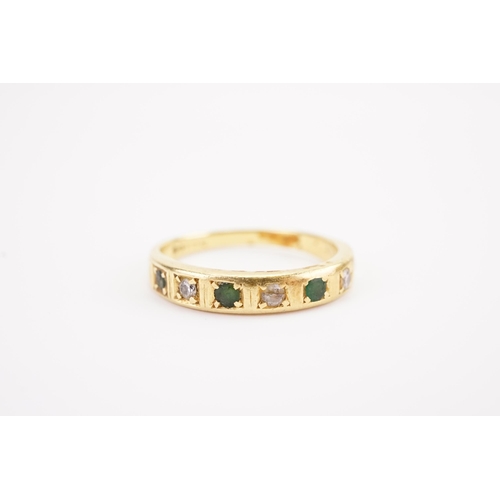 120 - A 18ct gold diamond and emerald set ring half eternity ring. Weight 3.8g AF.