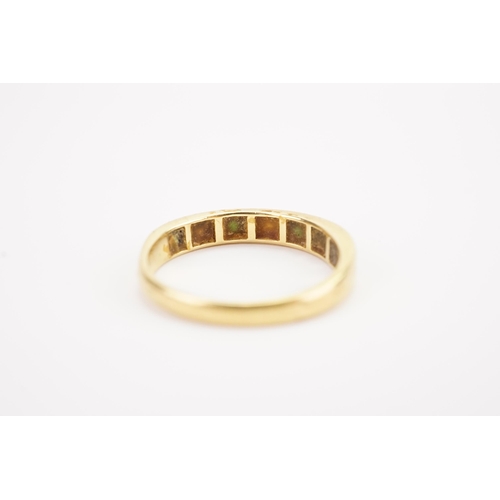 120 - A 18ct gold diamond and emerald set ring half eternity ring. Weight 3.8g AF.