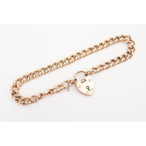 128 - A 9ct gold curb link love heart locket bracelet. All links marked. Weight 8.1g.