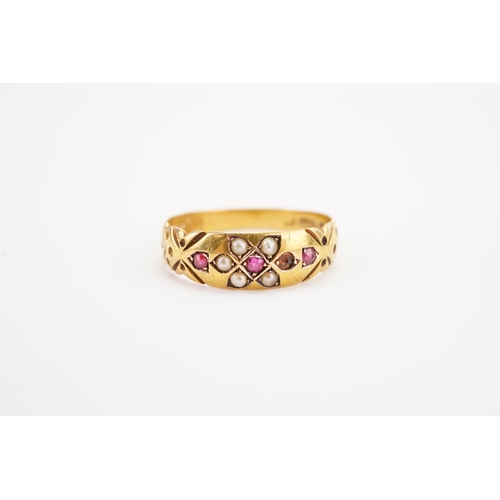 132 - A 15ct gold ruby and seed pearl set ring, in the Victorian design. Weight 2.2g. Size O.