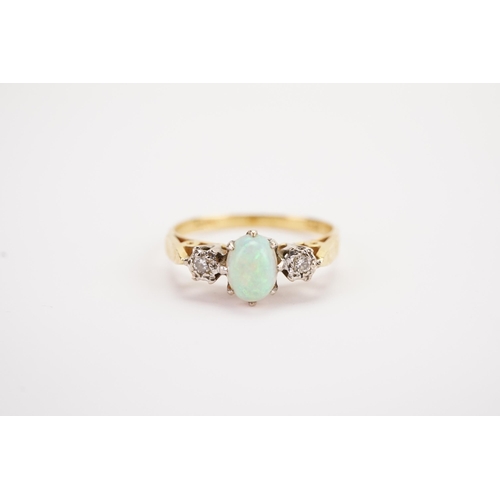 133 - A 18ct gold diamond and opal set ring, set with illusion set diamonds. Weight 2.2g. Size M.