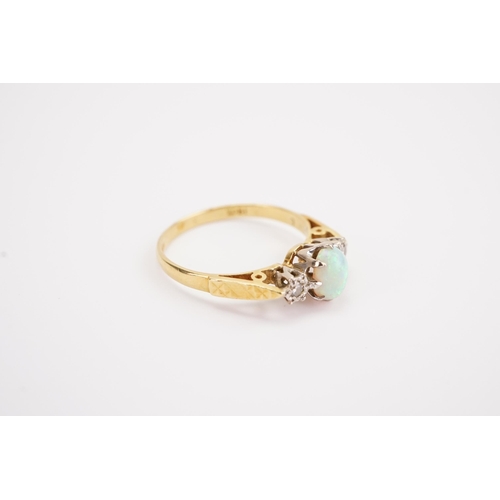 133 - A 18ct gold diamond and opal set ring, set with illusion set diamonds. Weight 2.2g. Size M.