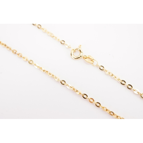 140 - A 9ct gold rolo chain, hung with a 15ct gold cross. Chain weight 2.5g. Cross weight 2.2g.