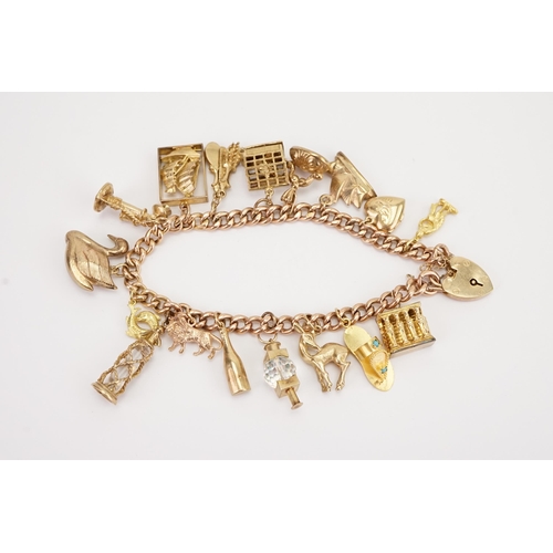 112 - A 9ct gold curb link charm bracelet, hung with various gold charms to include a 9ct gold Moet champa... 