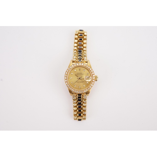 199 - An interesting 18ct gold ladies Rolex oyster date just, circa 1970's. Unique sapphire and diamond oc... 