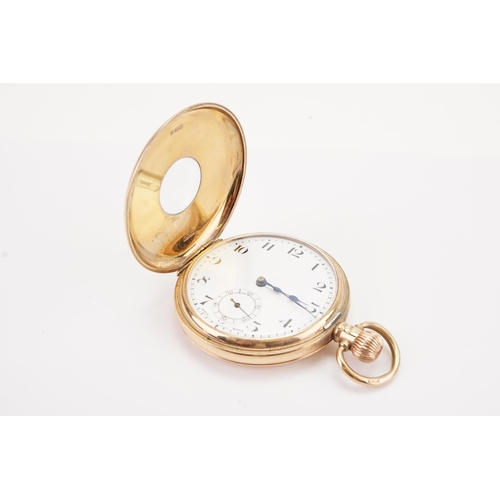 197 - A 9ct gold half hunter pocket watch, maker Nirvana watch Co, railroad dial and sub second dial. Weig... 