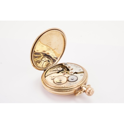 197 - A 9ct gold half hunter pocket watch, maker Nirvana watch Co, railroad dial and sub second dial. Weig... 