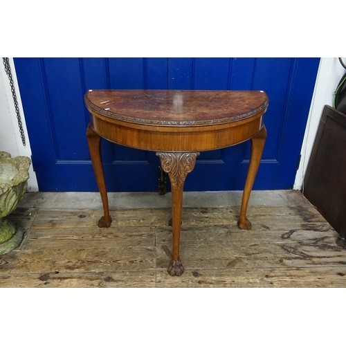 502 - A Reproduction Walnut & Banded Fold-Over Top Card Table with a carved gadrooned edge & resting on Li... 