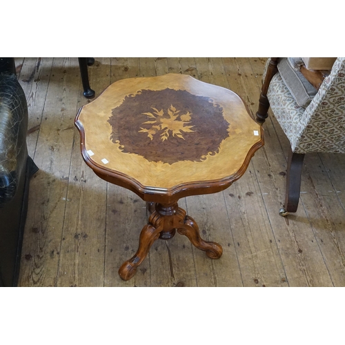 503 - An Italian Reproduction inlaid Wine Table resting on a Tripod Carved Base.