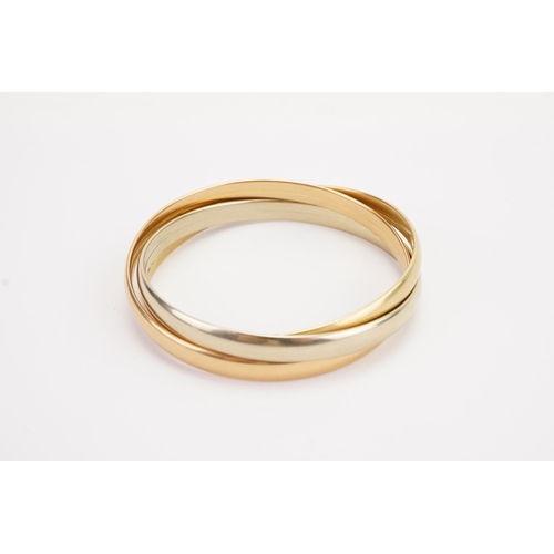 115 - A 18ct gold tri gold bangle. White, yellow and rose coloured. Only yellow gold bangle marked 750. We... 