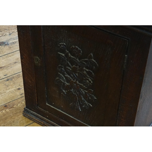 537 - An Oak Carved Panelled Fronted Single Door Cabinet. Measuring: 53cms x 34cms x 67cms high.