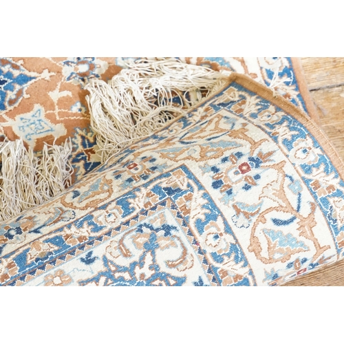 549 - A Orange Ground Isfahan Silk Rug. In Cream & Blue Central Star Quarter Floral & Cream & Blue Triple ... 