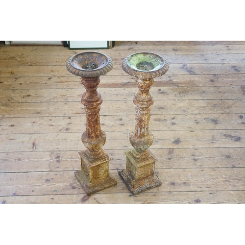 566 - A Pair of Cast Iron Torchere Stands of Classical design. Measuring: 70cms High.