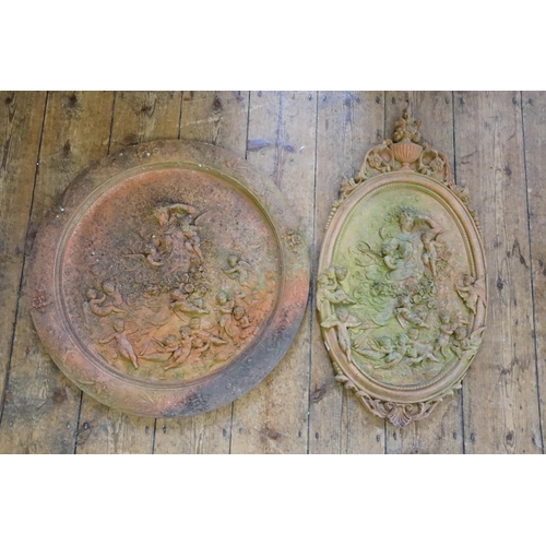 568 - A Classical Terracotta design Circular Garden Plaque decorated with a Classical scene & one other.