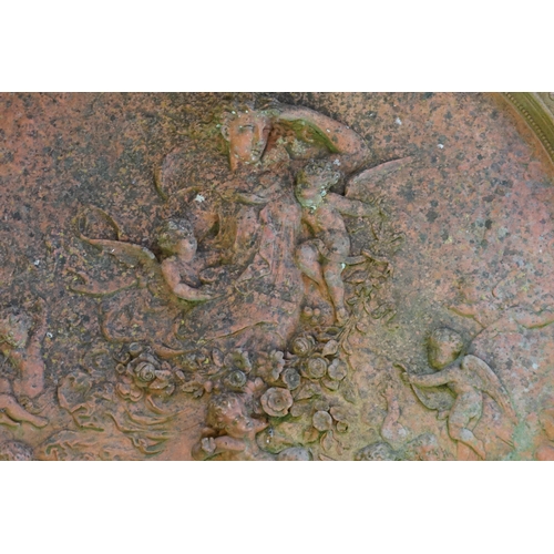 568 - A Classical Terracotta design Circular Garden Plaque decorated with a Classical scene & one other.