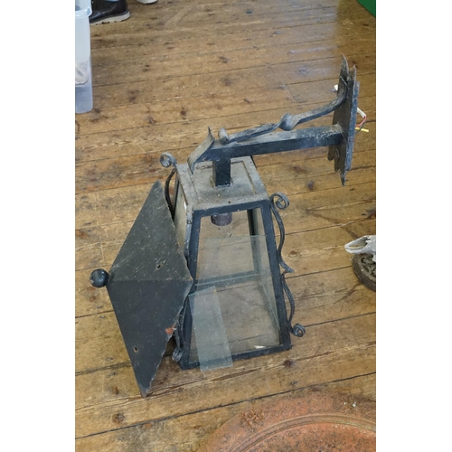 550 - A Georgian design Wrought Iron Entrance Hall Lamp. Measuring: 68cms x 31cms x 43cms.