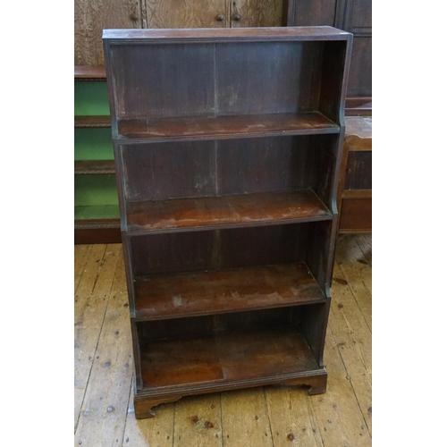 525 - A Regency Design Mahogany Waterfall Bookcase resting on shaped Legs. Measuring: 66cms across x 123cm... 