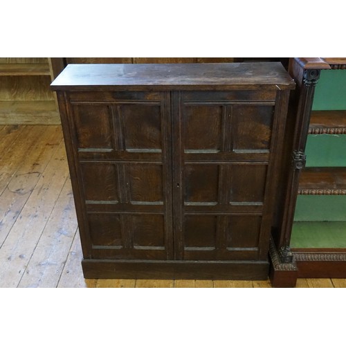 527 - An Oak Panelled Door Glass Cupboard. Measuring: 69cms across x 85cms high x 24cms deep.