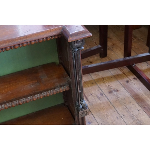 529 - A Victorian Mahogany Bookcase with Turned Spindle Facade with Ovo decoration. Measuring: 147cms acro... 