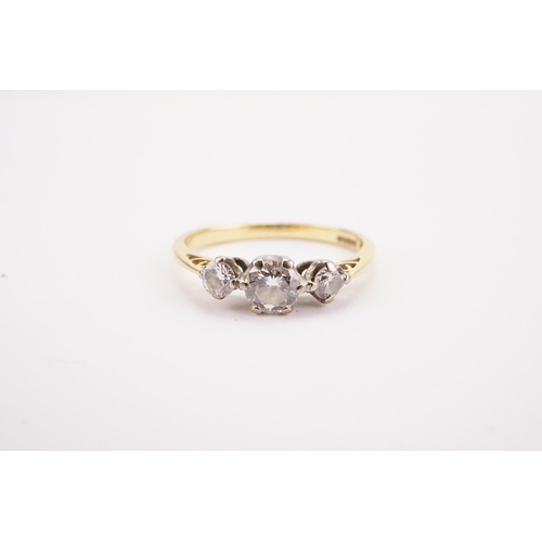 103 - A 18ct gold three stone diamond set ring, largest stone approximately 0.3ct. Weight 1.9g. Size L.