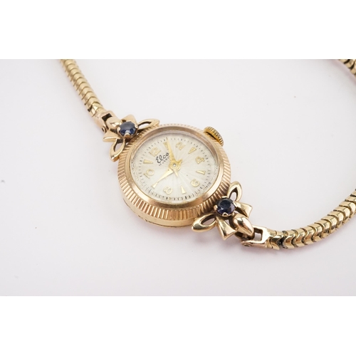 203 - A 9ct gold ladies Leco cocktail watch, set with two sapphires on the shoulders, 9ct gold snake brace... 