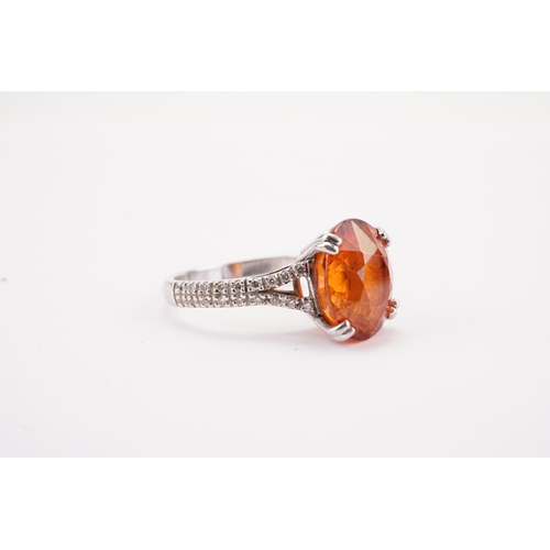 107 - A platinum mandarin garnet set ring, set with diamond shoulders. Approximately 0.5ct diamonds. A app... 