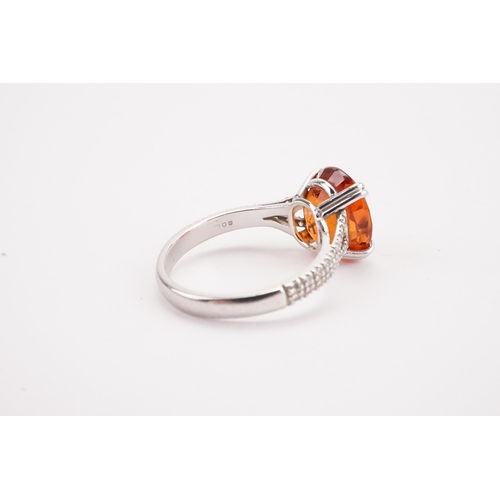 107 - A platinum mandarin garnet set ring, set with diamond shoulders. Approximately 0.5ct diamonds. A app... 