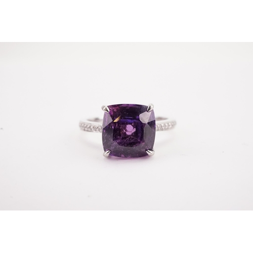 108 - A natural purple sapphire and diamond set ring, set with a East African translucent natural purple s... 