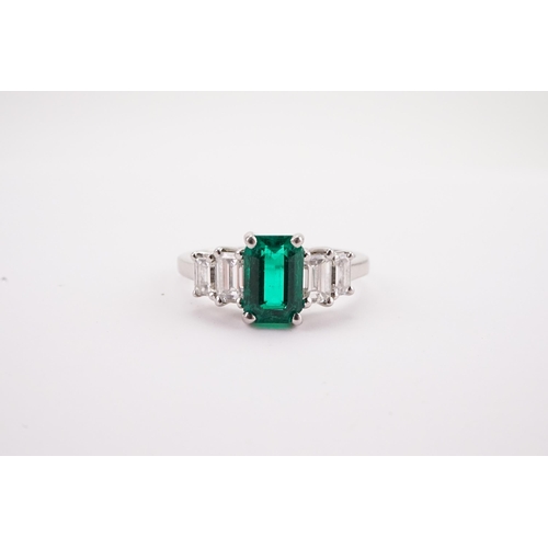 109 - A Columbium Natural Emerald and Diamond Set Ring, set with colourless rectangular diamond shoulders.... 