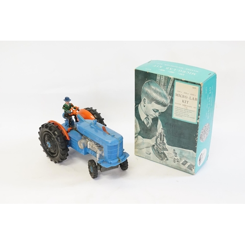 593 - A Large Plastic Battery Operated Tractor with Driver finished in Blue & Orange (Measuring: 27cms Lon... 