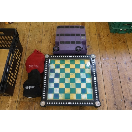 557 - A Harry Potter Chess Set along with the Large Harry Potter Bus Carry Case.